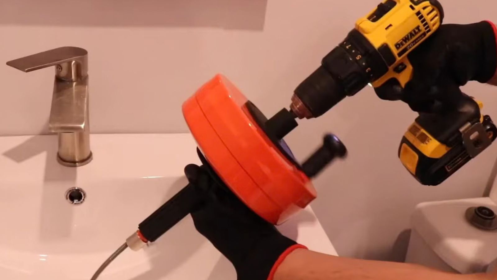 Plumber performing drain cleaning service in Littleton, CO